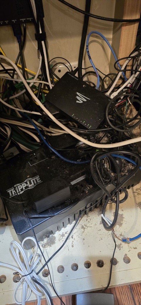Dust-covered cable tangle, before